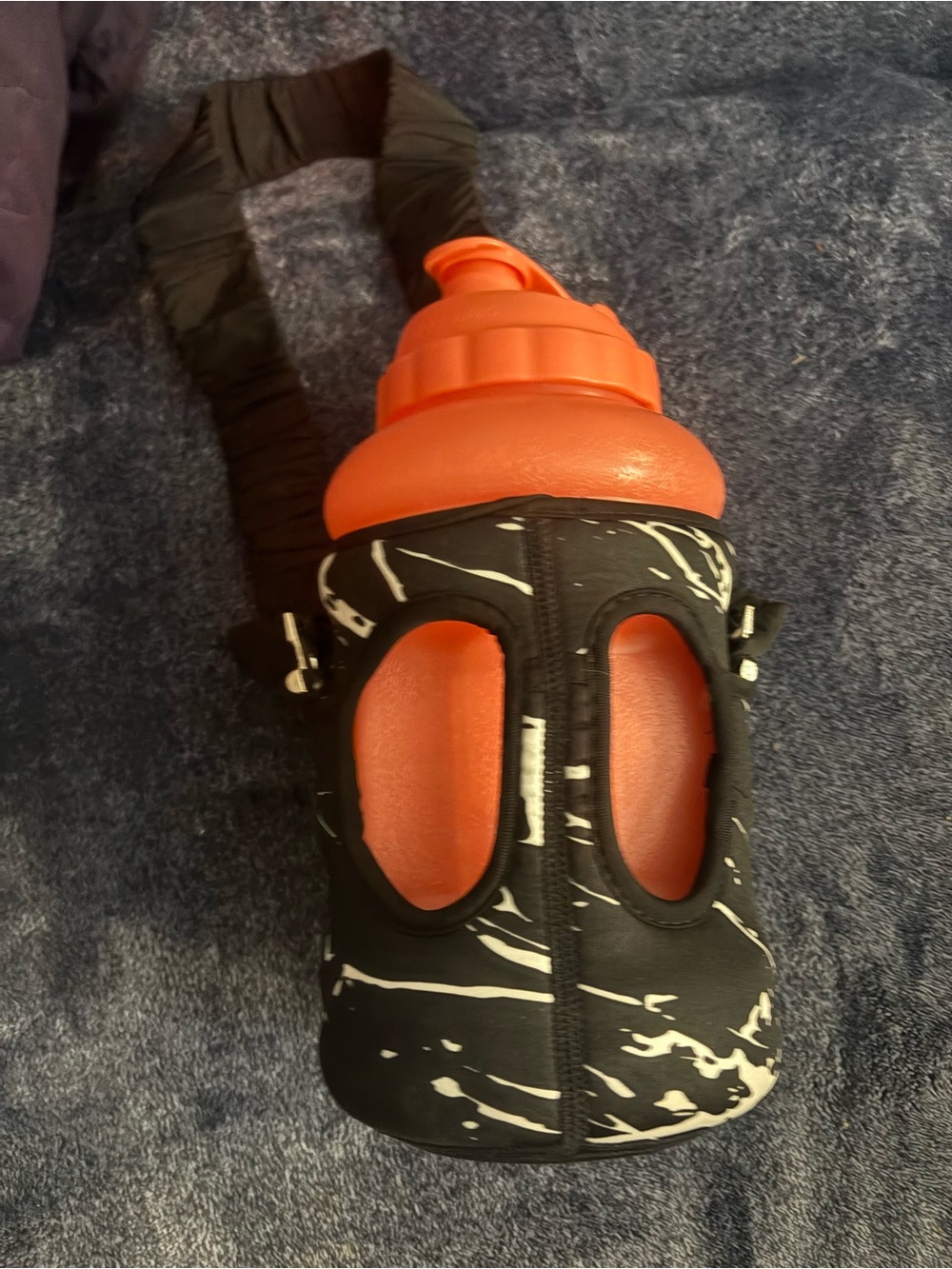 Excellent condition Orange Water Bottle with Black Marble Neoprene Carrier